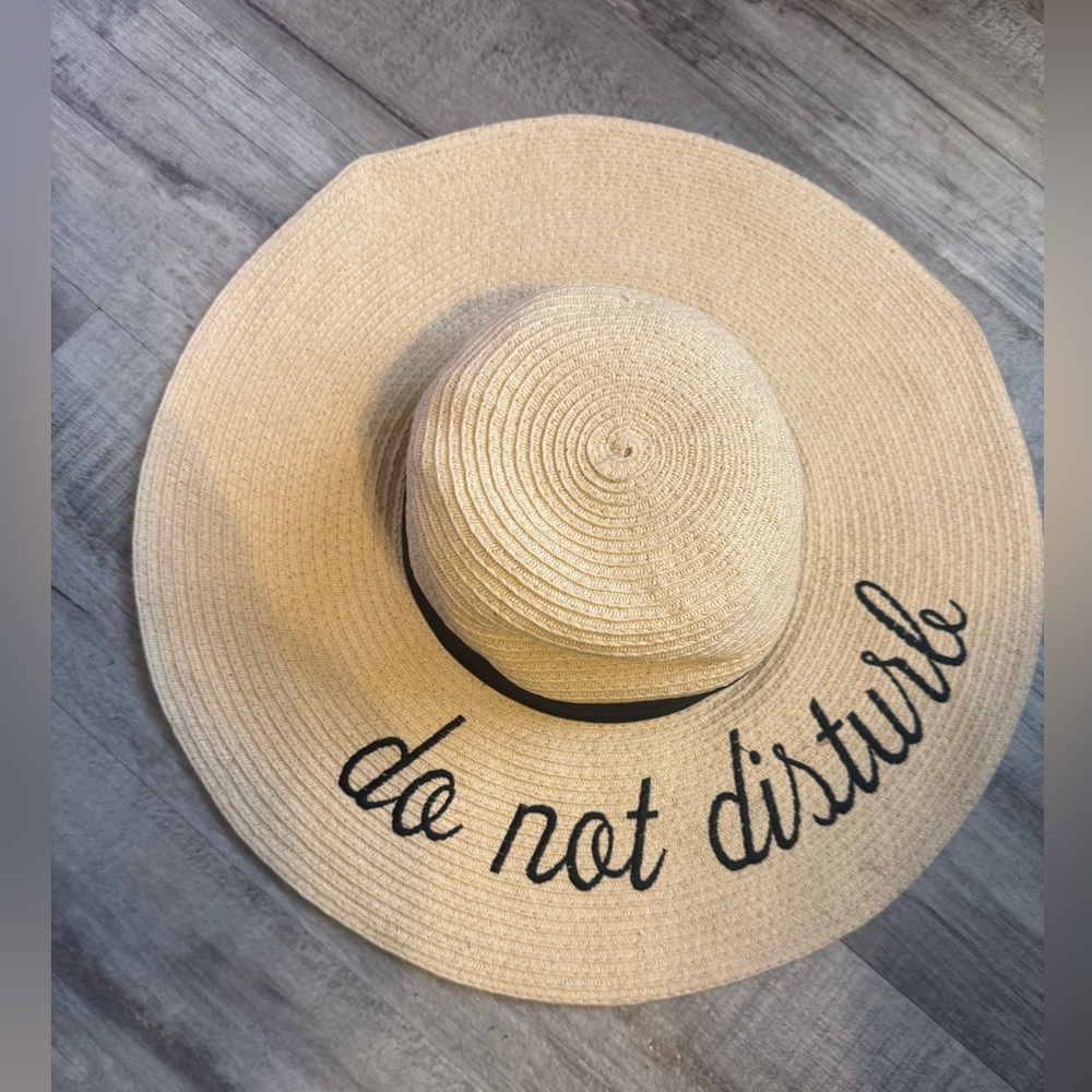 Floppy beach hat says do not disturb